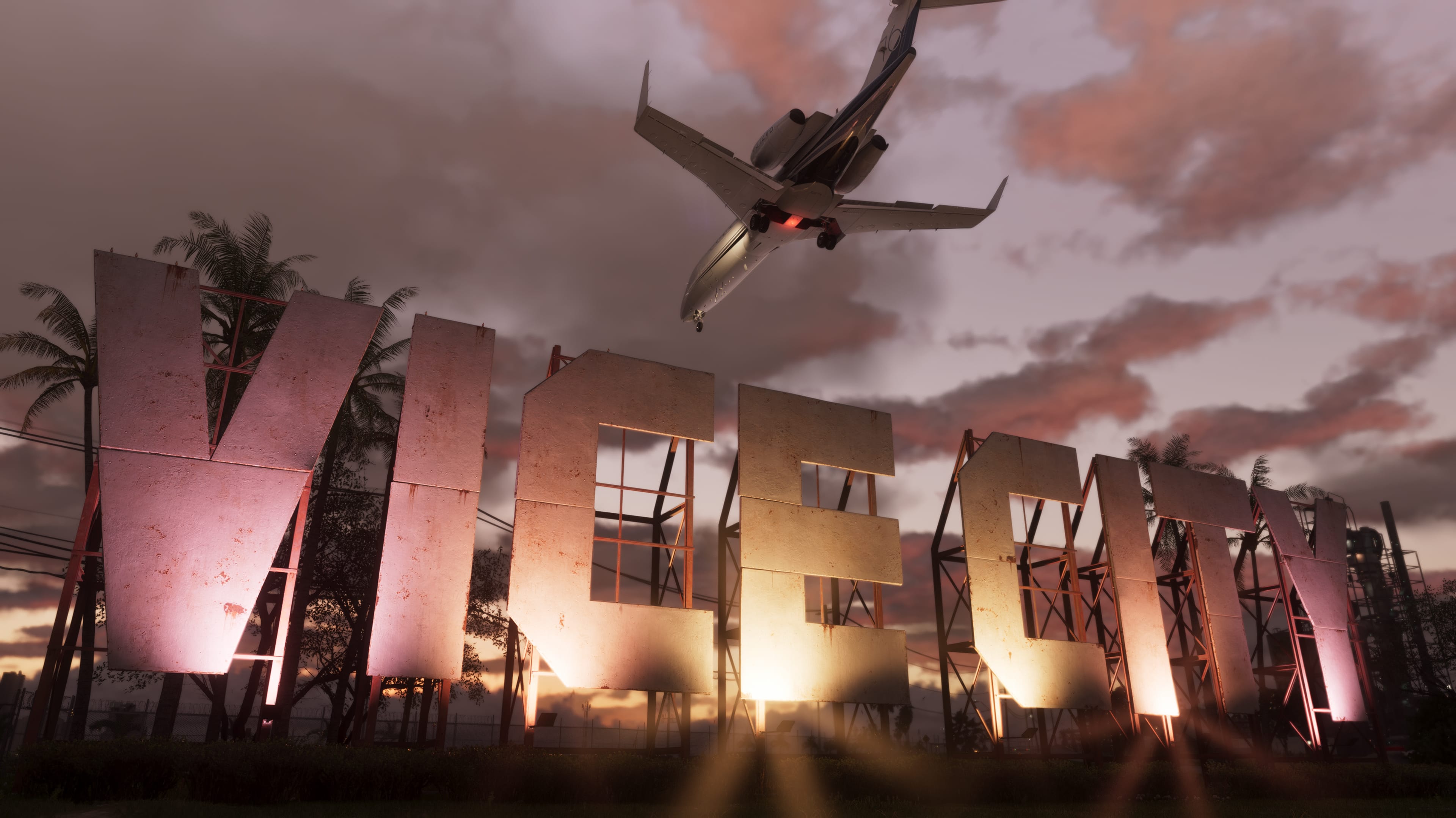 Official GTA VI screenshot of the Vice City sign beneath a jet at sunset